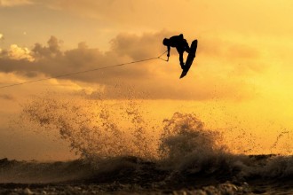 Bild på Wakeboarder Getting Air During Sunset