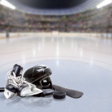 Bild på Dramatic Hockey Arena With Equipment on Reflective Ice and Copy Space Deliberate focus on foreground equipment and shallow depth of field on background Lighting flare effect