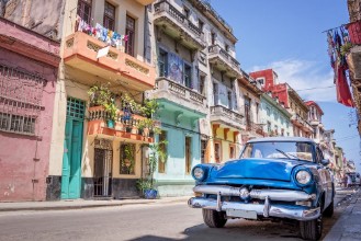 Picture of Blue vintage classic american car in a colorful street of Havana Cuba Travel and tourism concept