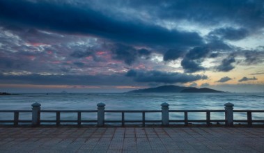 Picture of A colourful cloudy morning sky over the south china sea and  islands of the coast of Nha Trang central Vietnam