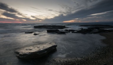 Afbeeldingen van Sunset  on a rocky coastline