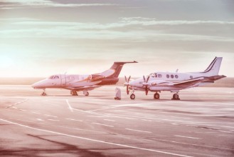 Bild på Private jet planes parking at the airport Private airplanes at sunset