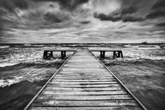 Picture of Old wooden jetty during storm on the sea Dramatic sky