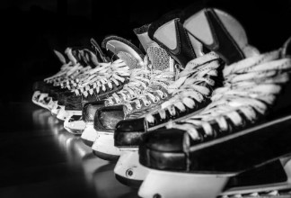 Bild på Hockey skates lined up in locker room